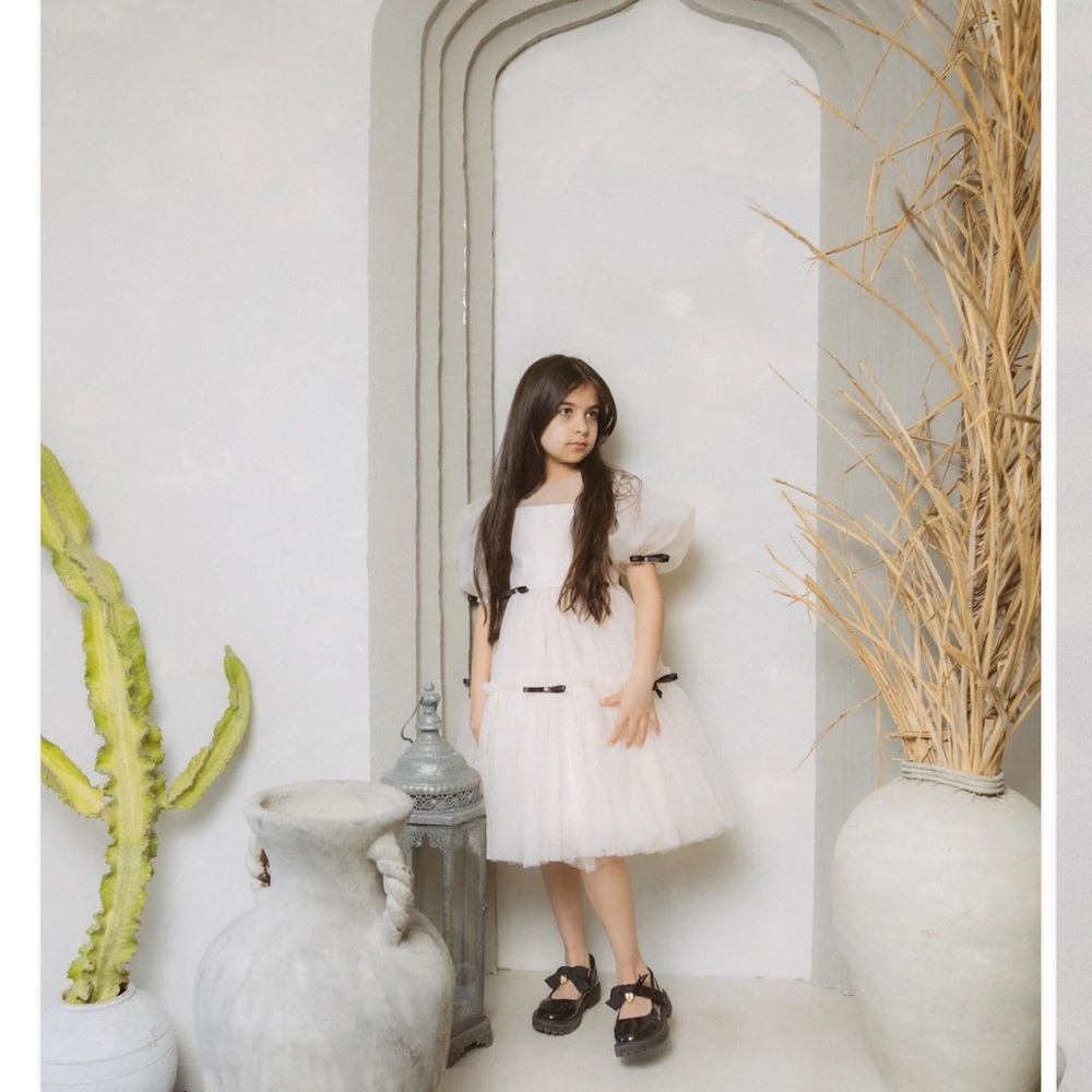 Elegant Cream toddler  Dress with Black ribbon Accents